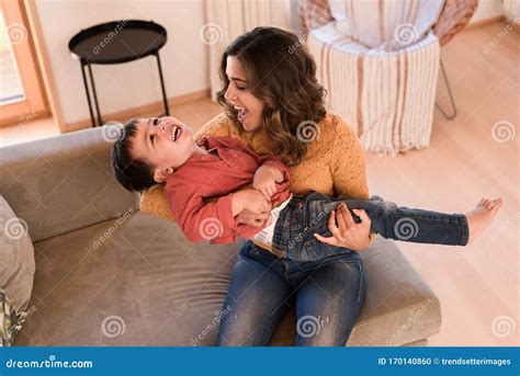 Mother And Son Relaxing In The Living Room Stock Photo Image Of