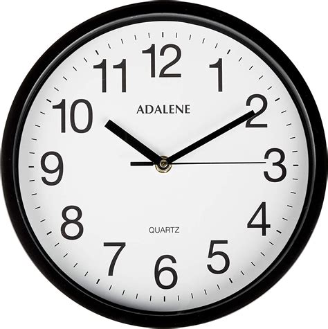 A Black And White Clock Showing The Time