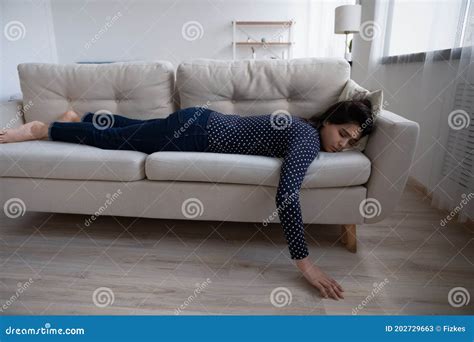 tired exhausted asian woman sleeping on couch at home stock image image of fall alone 202729663