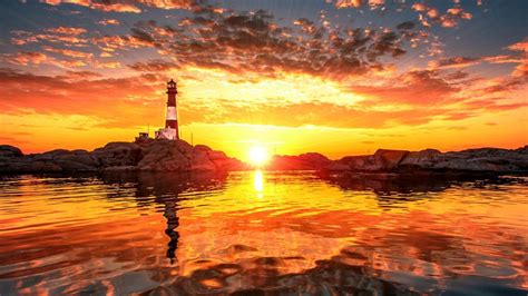 Lighthouse Sunset Sunlight Ocean Rocks Stones Clouds Hd Wallpaper