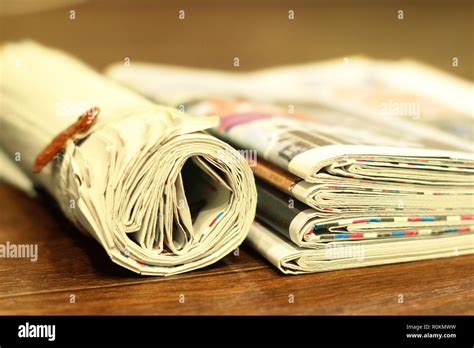 Newspapers Folded And Rolled Side View Stock Photo Alamy
