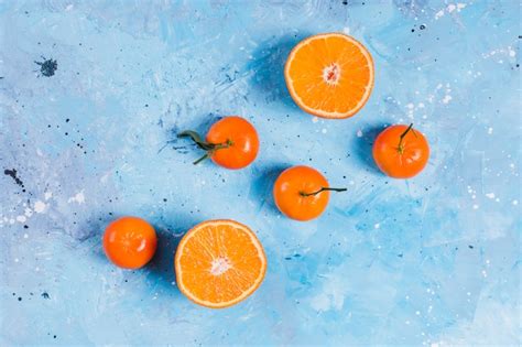 Bright Orange Fruit On Blue Free Photo