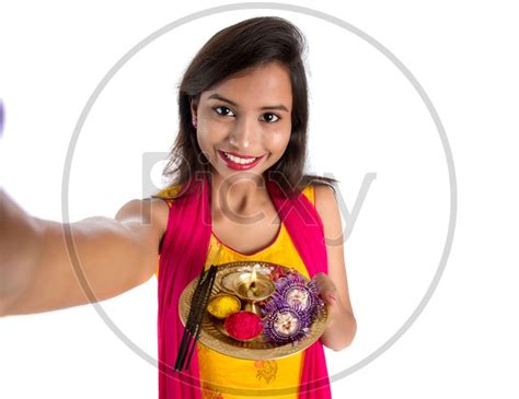 Image Of Beautiful Indian Girl Holding Pooja Thali Or Pooja Plate In