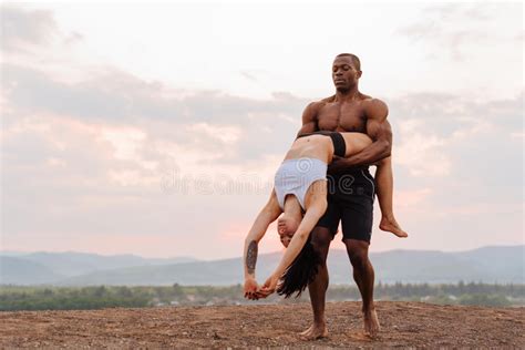 Mixed Race Gymnastic Couple With Perfect Muscular Bodies In Sportswear