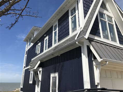 If your siding is tan or beige, go for black, brown, dark blue, or dark green roofing. A-Frame addition remodel part 2. LP Smartboard siding-- Board and batten with shake, painted cus ...