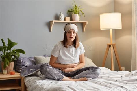 Portrait Of Upset Caucasian Woman Suffering From Strong Abdominal Pain