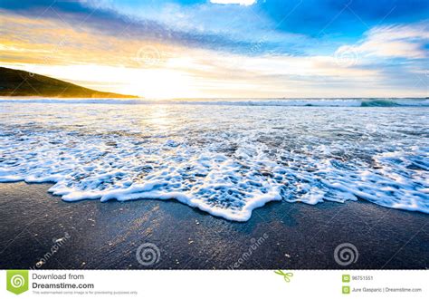 Small Ocean Sea Waves On Sandy Beach With Sunrise Sunset Stock Image