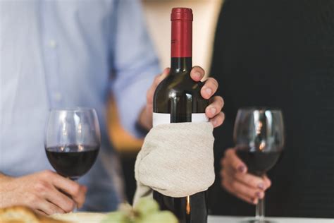 Holding wine glass stock images from offset. Man Holding White Labeled Red Wine Bottle Near Wine Glasses · Free Stock Photo