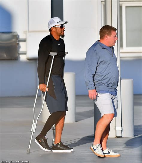 Tiger Woods Is Seen Hobbling On Crutches Four Months After Horror Car Crash Daily Mail Online