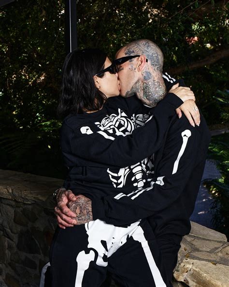 kourtney kardashian shares steamy kiss with travis barker in matching onesies after being