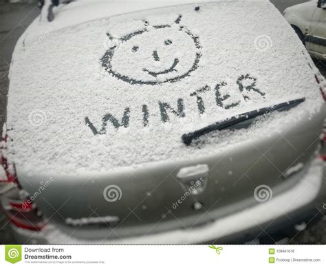 Photo Of A Car Glass Covered With Snow And Smiley Stock Photo Image