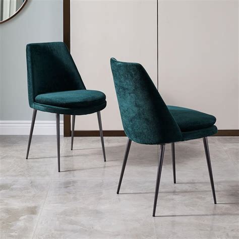 Striking a stylish contoured shape that's ideal for complementing the decor in any room, this design is stuffed with foam for added comfort and. Finley Low-Back Velvet Dining Chair | west elm AU