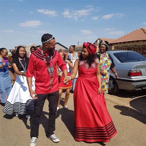 clipkulture couple in red xhosa umbhaco traditional wedding outfit