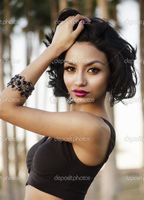 Beautiful Exotic Young Woman Stock Photo By ©avfc 32922197
