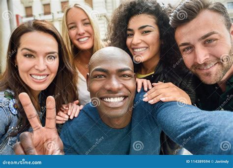 Multiracial Group Of Friends From Five Young Women Walks On City Street Royalty Free Stock Image