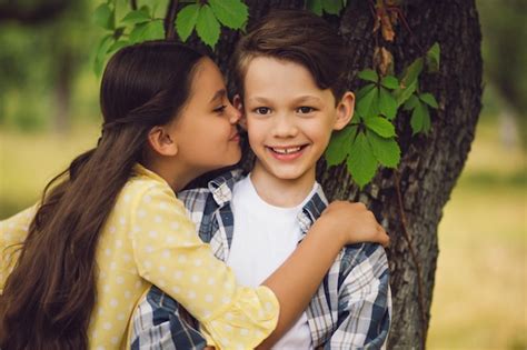 Free Photo Sister Kissing Brother On Cheek