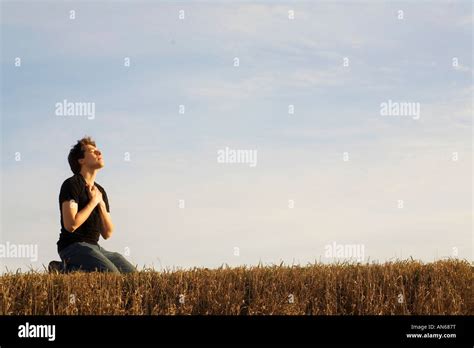 A Man Kneeling In Worship To God Stock Photo 15425627 Alamy