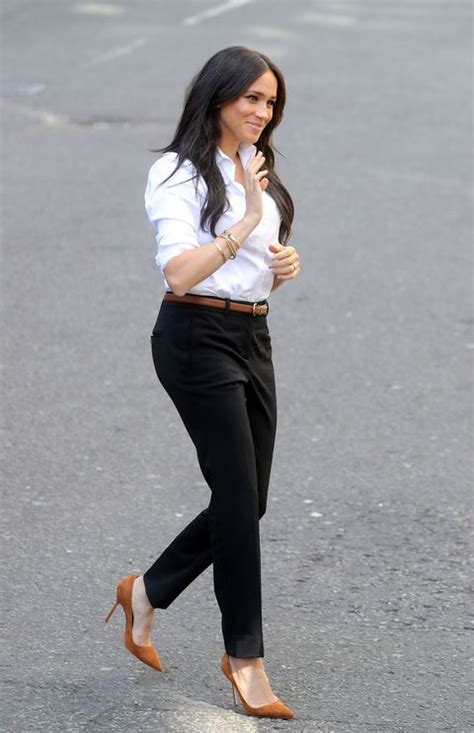 Meghan Markle Wears A Blouse Trousers And Princess Dianas Jewelry To
