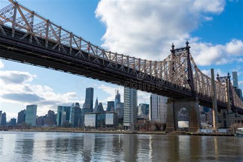 Queensboro Bridge Along The East River With The Midtown Manhattan