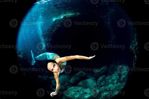 Mermaid Swimming Underwater In The Deep Blue Sea 20384590 Stock Photo