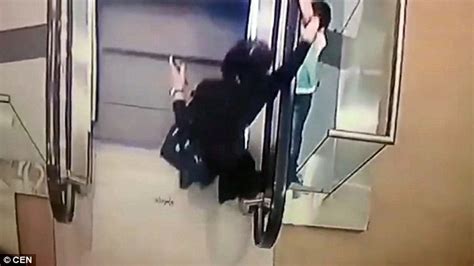 russian girl slips out of her aunt s hand and falls 2 floors from an escalator daily mail online