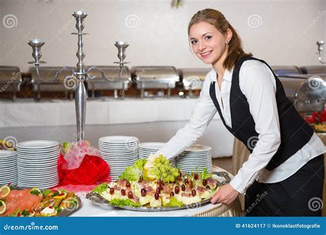 Catering Service Employee Or Waitress Preparing A Buffet Stock Image