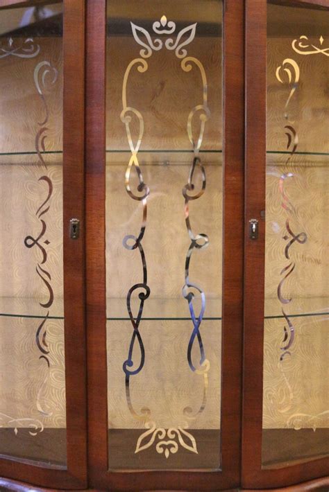 This cabinet features a walnut stain and curved back splash over a serpentine facade with three glass panes and mullions. Antique English Art Deco China Cabinet, Curio, Display ...