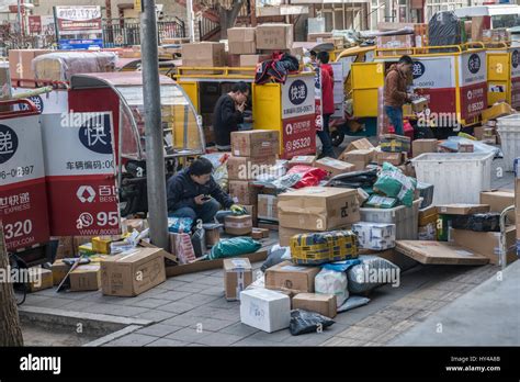 Chinese Delivery Men Sort Parcels In Beijing China 01 Apr 2017 Stock