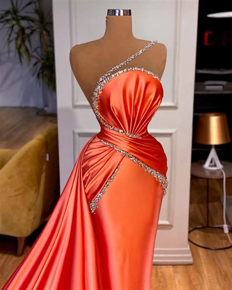 Unique Redorange Valdrin Sahiti Gown With Rhinestone Strap Glamour
