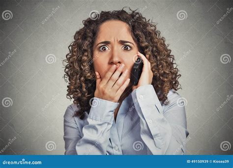 shocked stunned woman getting bad news while talking on mobile phone stock image image of