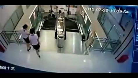 Chinese Woman Dies After Getting Trapped In Escalator But Saves Son