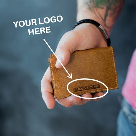 A Person Holding A Wallet With The Words Your Logo Here And An Arrow