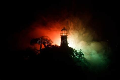 Lighthouse With Light Beam At Night With Fog Old Lighthouse Standing