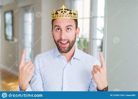 Handsome Business Man Wearing Golden Crown As A King Or Prince Amazed