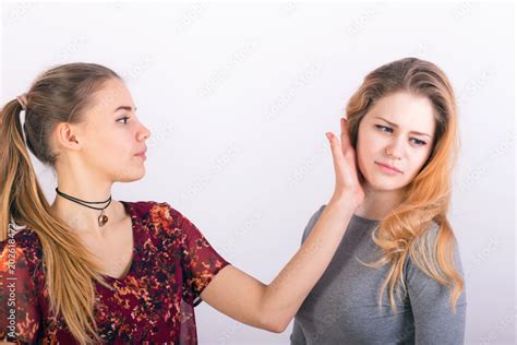 Two Young Woman Fighting A Slapping In The Face Stock Photo Adobe Stock