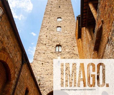torre grossa big tower bottom view from medieval streets of san gimignano italy model released