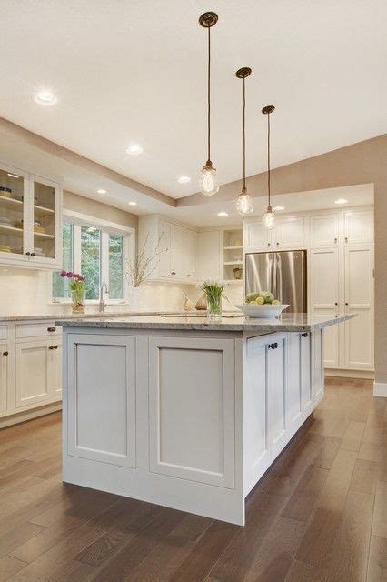 Some shaker cabinets are very clean and simple, while other have decorative edge detailing. Design ideas for a transitional u-shaped kitchen in ...