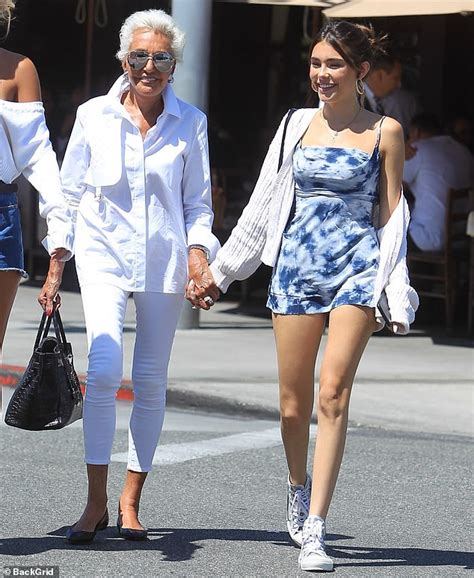 madison beer strolls hand in hand with her grandmother as the pair enjoy quality time in los