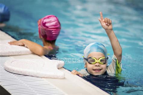 Boy Celebrating Swimming Race Win In Swimming Pool — Poolside Sport