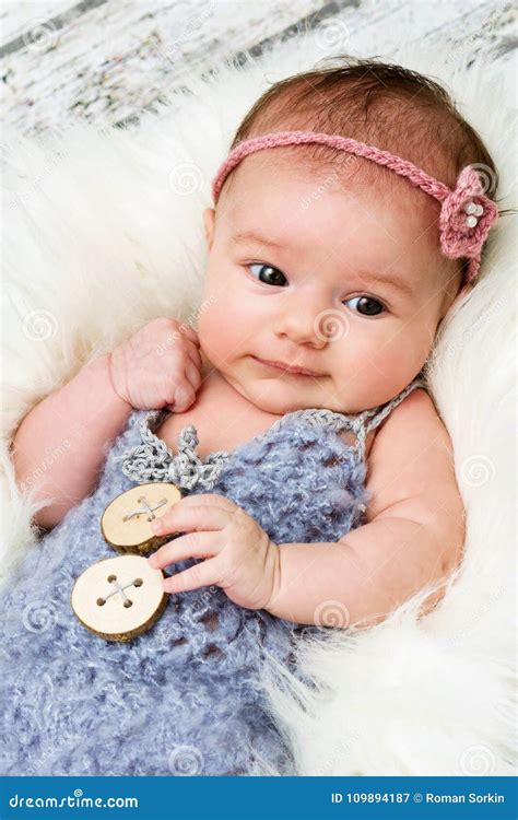 Adorable Little Newborn Baby Girl Smiling And Looking Stock Image