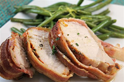 Are you looking for a recipe that brings smiles to the table and sighs of relief after family dinner? Bacon-Wrapped Pork Tenderloin