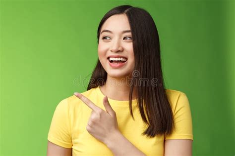 Close Up Cheerful Friendly Asian Outgoing Girl Having Fun Pointing Turn Left Amused Lively