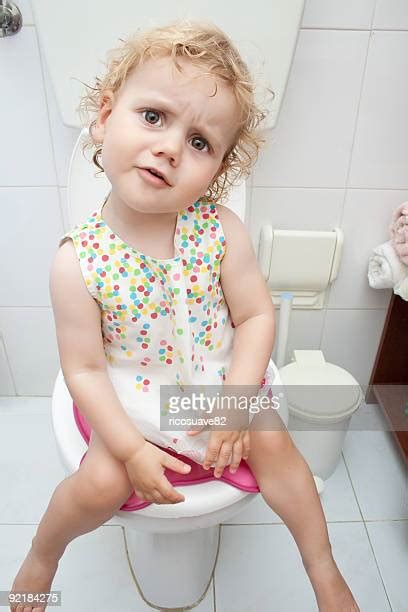 Girl Peeing On Toilet Stockfotos En Beelden Getty Images