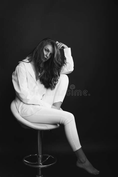 Splendid Model Sitting On A Chair At Dark Room Stock Image Image Of