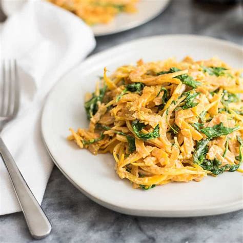 Butternut Squash Noodles With A Creamy Garlic Sauce With Arugula On