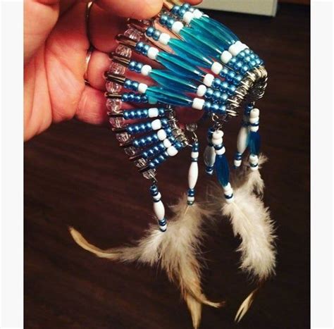 A Beautiful Teal And White Beaded Indian Headdress That Hangs On Your Car