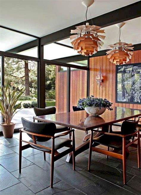 The tulip table design is attractive because it is held up by a single central pedestal base. 38+ Cool Mid Century Dining Room Ideas | Dining room table ...
