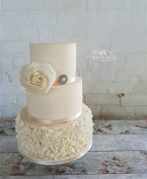 3 Tier Wedding Cake With Ivory Ruffles And Whimsical Rose Flickr