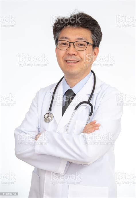 Asian Doctor Smiling Isolated On White Background Stock