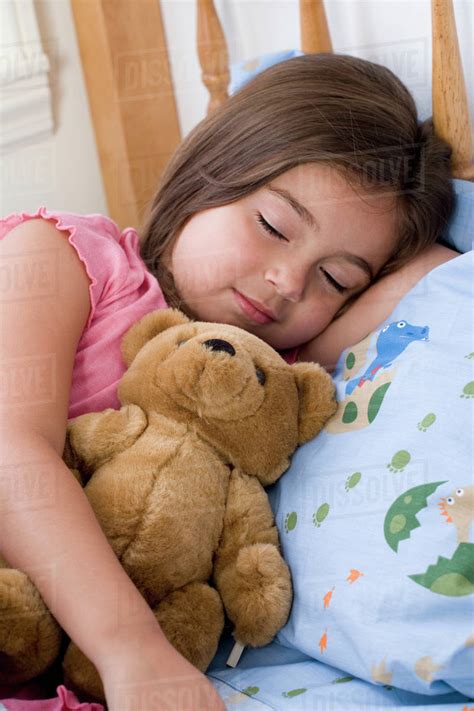 Hispanic Girl Sleeping With Teddy Bear Stock Photo Dissolve